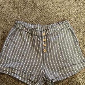 Women’s elastic waisted shorts. Blue and white striped.